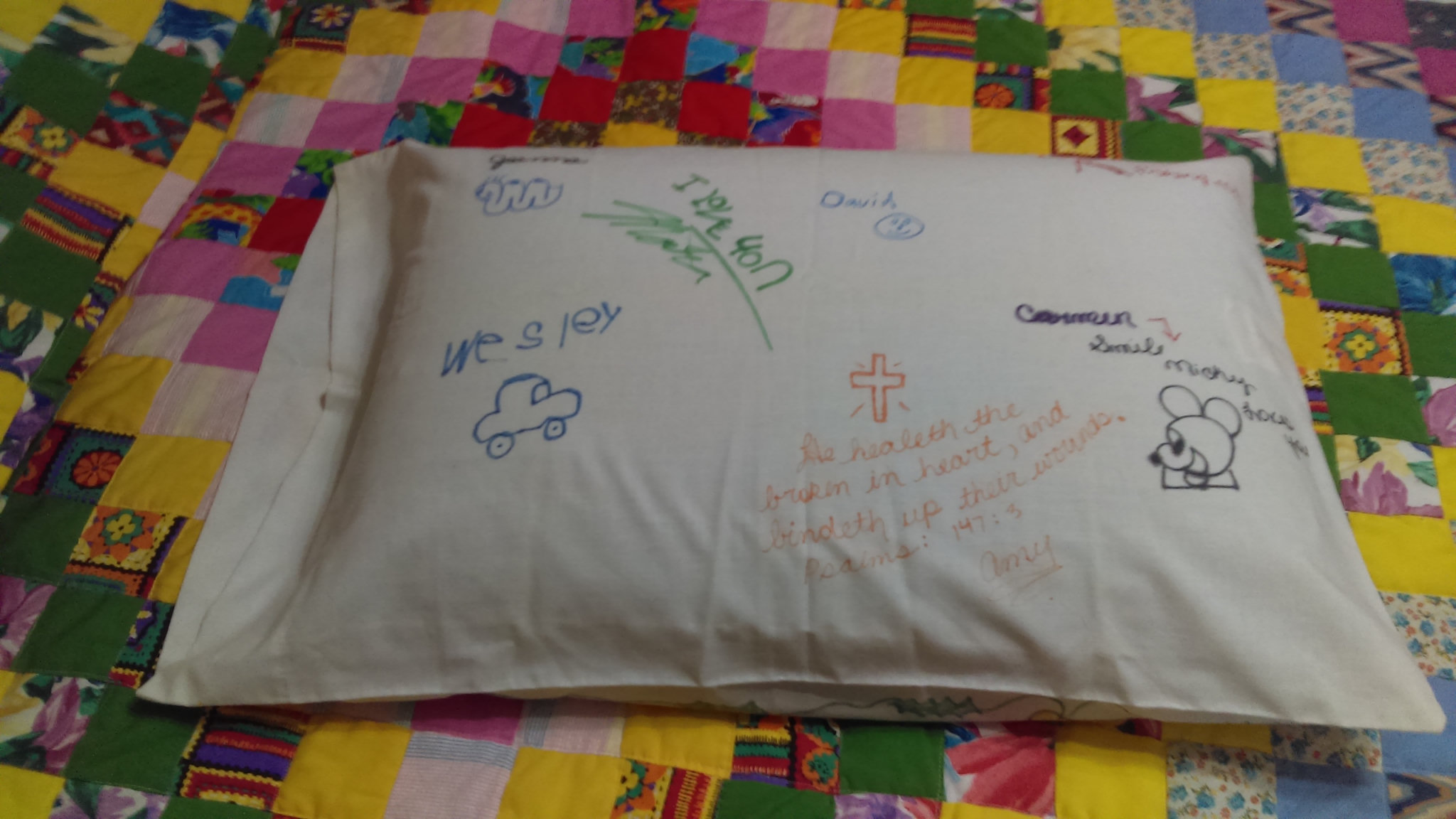 The back of the pillow, with drawings and encouraging messages from Amy and her siblings.