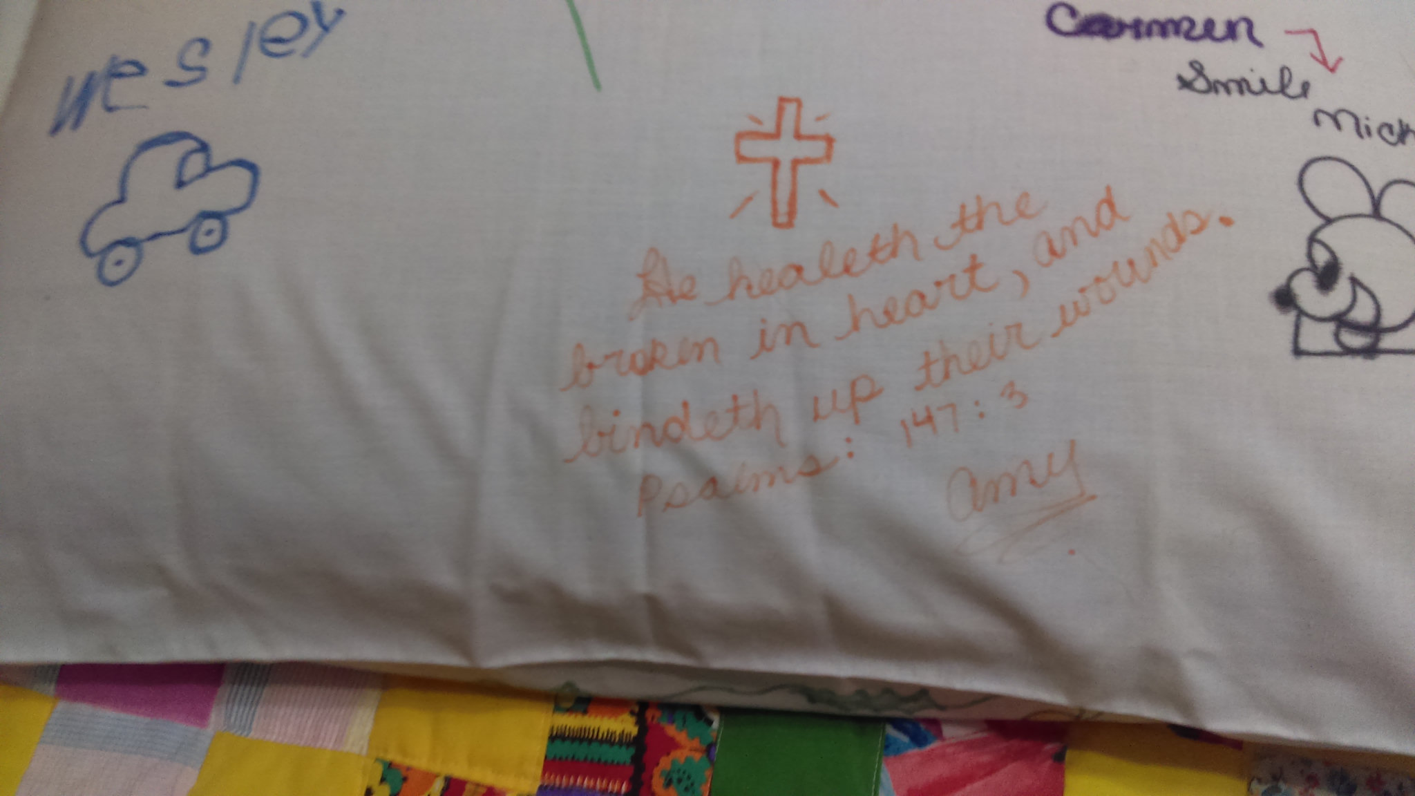 Amy’s message on the pillow: “He healeth the broken in heart, and bindeth up their wounds.” Psalm 147:3, signed Amy.